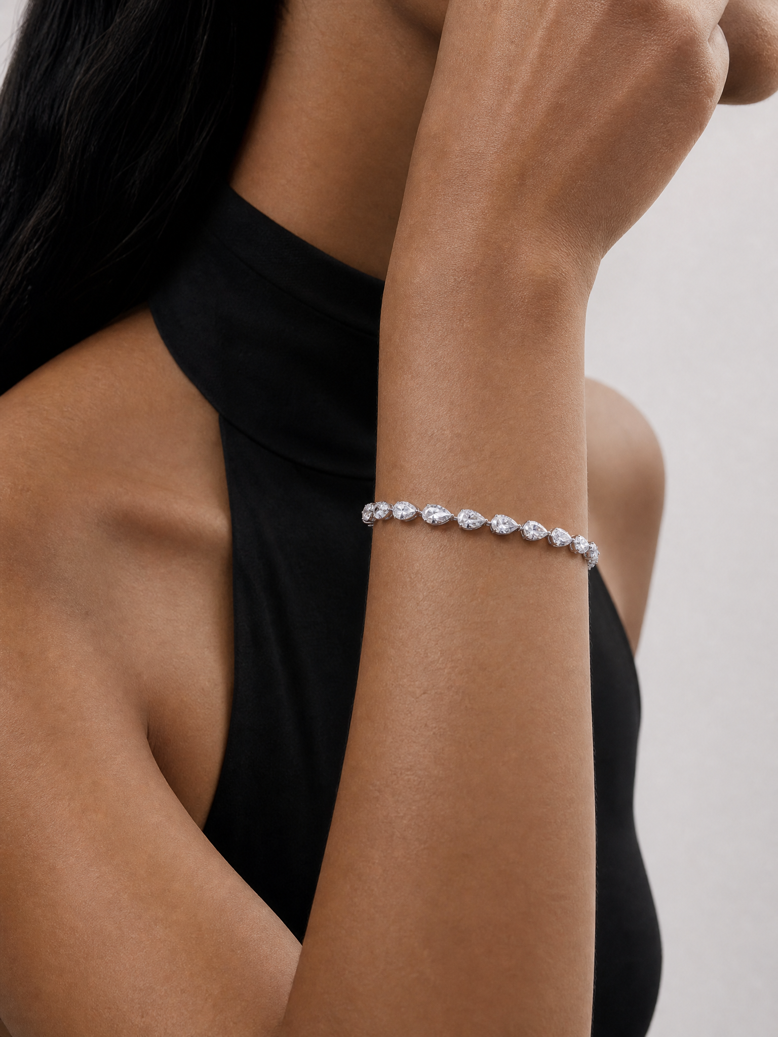 Model wearing Harlow George East-West Pear Diamond Tennis Bracelet