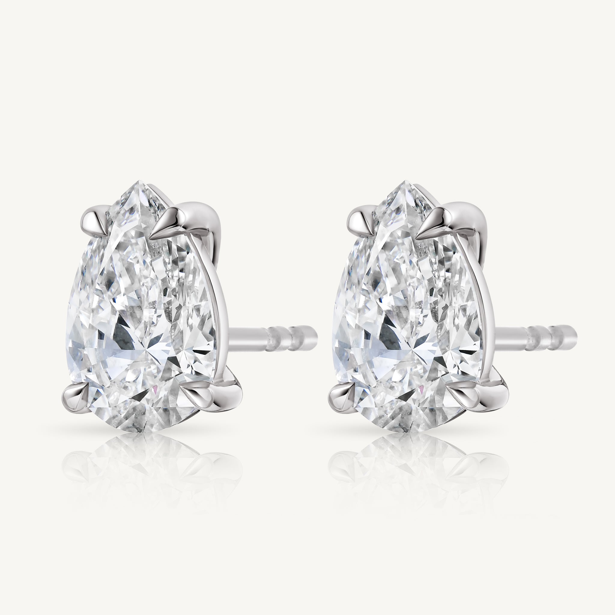 A pair of pear-cut diamond stud earrings 14k white gold by Harlow George