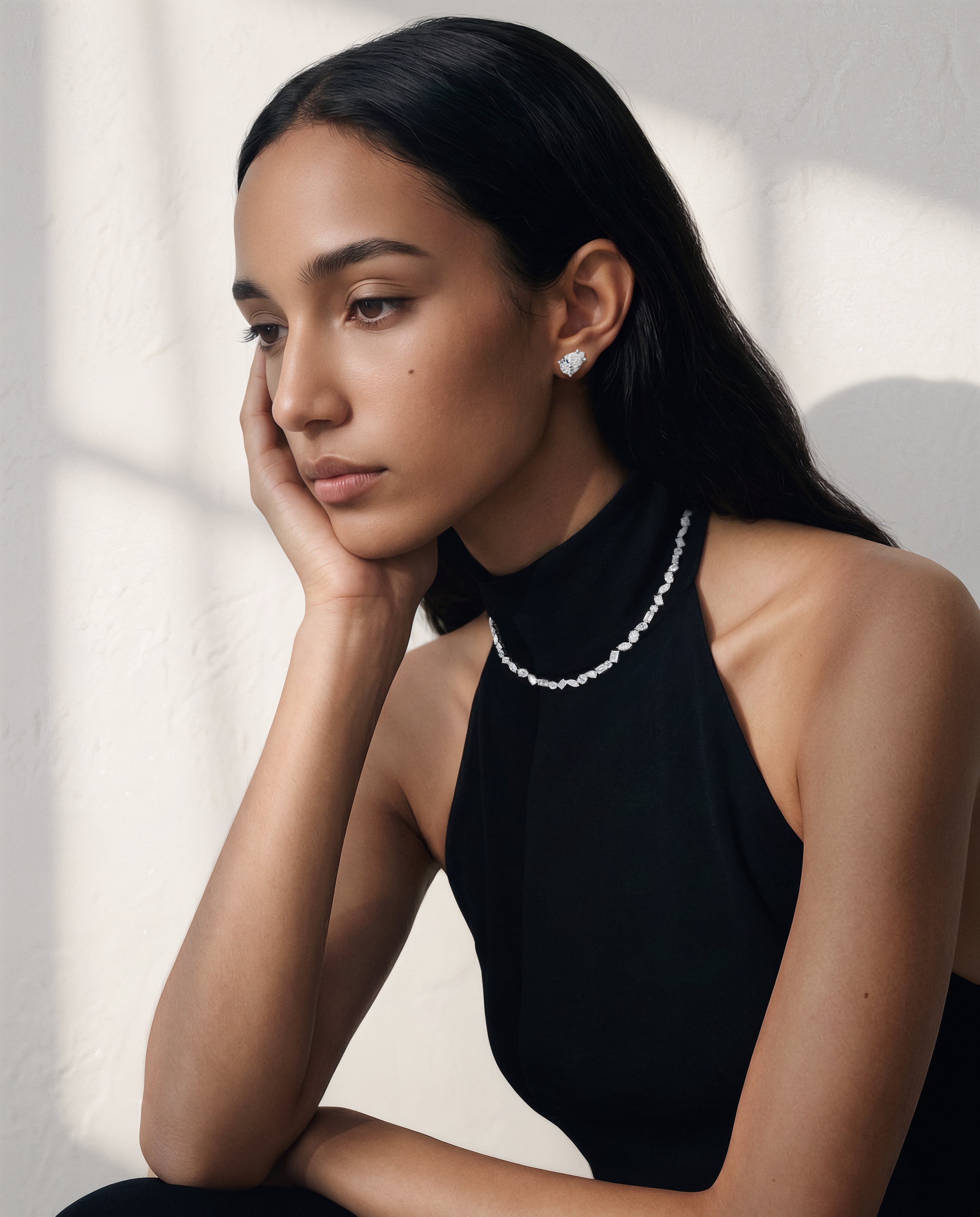 Model wearing Pear Diamond Stud Earrings, 6.00 total carat pair (3.00 carats each)